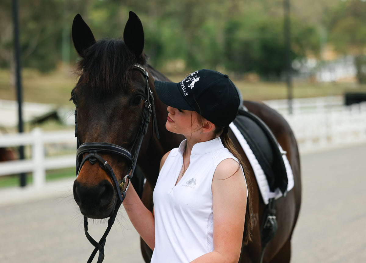 Rider and horse moving through an open field